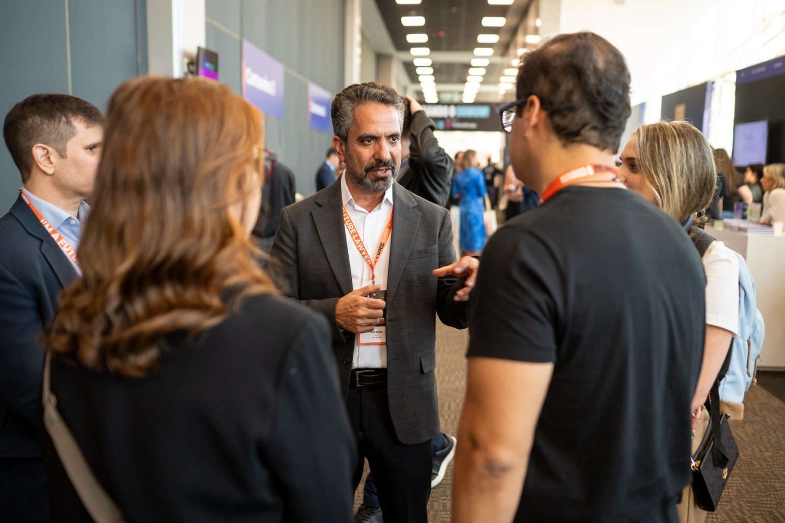 Mori Kabiri speaking with legal professionals at a conference